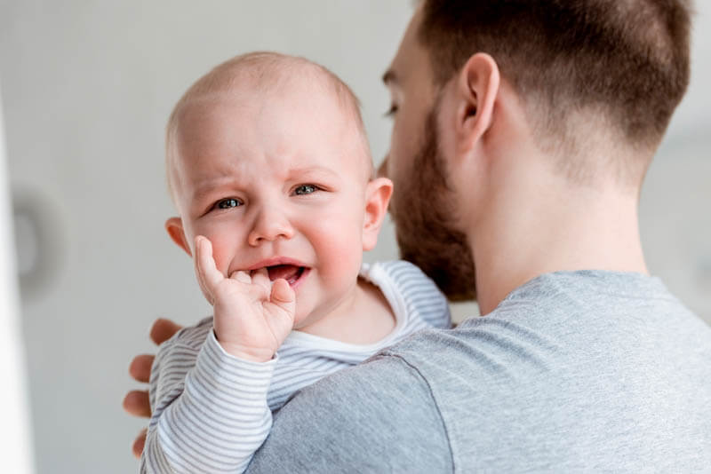 teething baby crying